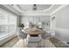 Elegant dining room with modern lighting and neutral decor provides a sophisticated dining experience at 3007 Gambrill Falls Dr, Indian Trail, NC 28079