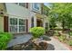 Charming home with well-maintained landscaping and inviting front porch exudes curb appeal at 3007 Gambrill Falls Dr, Indian Trail, NC 28079