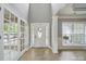 Inviting foyer with high ceilings, decorative door, and ample natural light welcomes guests at 3007 Gambrill Falls Dr, Indian Trail, NC 28079