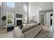 Bright living room with fireplace, large windows, and neutral tones offers a cozy and inviting atmosphere at 3007 Gambrill Falls Dr, Indian Trail, NC 28079