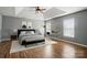 Serene main bedroom with tray ceiling and ample natural light offers a peaceful retreat at 3007 Gambrill Falls Dr, Indian Trail, NC 28079