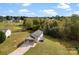 Aerial view of a single-story house with carport surrounded by lush greenery at 301 Walkers Ridge Dr, Shelby, NC 28152