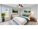 This bedroom features wood-look floors, neutral walls, a ceiling fan, and two end tables at 301 Walkers Ridge Dr, Shelby, NC 28152