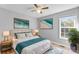 Bright bedroom featuring a ceiling fan, natural light, and beach-themed decor over a bed at 301 Walkers Ridge Dr, Shelby, NC 28152