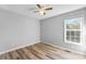 Bedroom with window, ceiling fan and wood-look floors at 301 Walkers Ridge Dr, Shelby, NC 28152