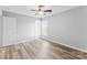 This bedroom features wood-look floors, neutral walls, and a ceiling fan at 301 Walkers Ridge Dr, Shelby, NC 28152