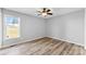 Simple bedroom with large window and hardwood floors at 301 Walkers Ridge Dr, Shelby, NC 28152