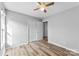 This bedroom features wood-look floors, neutral walls, a ceiling fan, and a closet at 301 Walkers Ridge Dr, Shelby, NC 28152