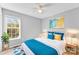 Bright bedroom with wood-look floors, ceiling fan, and window at 301 Walkers Ridge Dr, Shelby, NC 28152