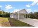 Exterior view of a home with a attached carport, green lawn, and mature trees at 301 Walkers Ridge Dr, Shelby, NC 28152