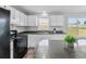 Well-lit kitchen featuring a large island, modern appliances, and ample counter space at 301 Walkers Ridge Dr, Shelby, NC 28152