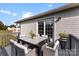 Cozy outdoor patio area with a dining table and chairs, ideal for relaxing and entertaining at 301 Walkers Ridge Dr, Shelby, NC 28152