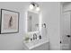 Stylish bathroom featuring a single vanity, sleek fixtures, and a modern aesthetic at 3216 High Ridge Rd, Charlotte, NC 28270