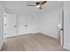 Well-lit bedroom with light hardwood floors and double door closet at 3216 High Ridge Rd, Charlotte, NC 28270