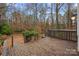 Deck with steps down to a wooded backyard at 3216 High Ridge Rd, Charlotte, NC 28270