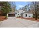 White two-story house with attached garage and landscaping at 3216 High Ridge Rd, Charlotte, NC 28270