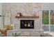 Stone fireplace with a wood mantel and a view to backyard at 3216 High Ridge Rd, Charlotte, NC 28270