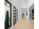 Light-filled hallway with hardwood floors and modern door at 3216 High Ridge Rd, Charlotte, NC 28270