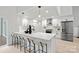 Modern kitchen with white cabinets, island, and stainless steel appliances at 3216 High Ridge Rd, Charlotte, NC 28270