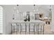 Modern kitchen island with white cabinetry and quartz countertop at 3216 High Ridge Rd, Charlotte, NC 28270