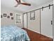 Bedroom with barn doors and hardwood floors at 3613 Ridge Rd, Indian Trail, NC 28079