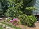 Landscaped garden features various flowering plants and stone walkway at 3613 Ridge Rd, Indian Trail, NC 28079