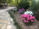 Beautiful garden with various colorful flowers and stone pathway at 3613 Ridge Rd, Indian Trail, NC 28079