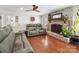 Living room with hardwood floors and a brick fireplace at 3613 Ridge Rd, Indian Trail, NC 28079