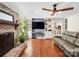 Living room with fireplace, built-in shelving, and hardwood floors at 3613 Ridge Rd, Indian Trail, NC 28079