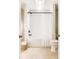 Neutral bathroom featuring a combination shower and tub with a white shower curtain and tiled floor at 501 River Oaks Ln, Charlotte, NC 28226