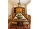 Formal dining room featuring a wooden table, eight chairs, and an ornate wooden hutch at 501 River Oaks Ln, Charlotte, NC 28226