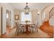 The dining room features hardwood floors, a round table with four chairs, and an elegant chandelier at 501 River Oaks Ln, Charlotte, NC 28226
