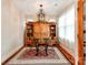 Charming dining room featuring a round glass table set and custom built-in cabinets with a decorative chandelier at 501 River Oaks Ln, Charlotte, NC 28226