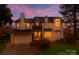 Charming two-story home with a well-manicured lawn, attached garage, and inviting entrance at 501 River Oaks Ln, Charlotte, NC 28226