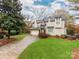 Charming traditional-style two-story home with a well-manicured lawn and attached two-car garage at 501 River Oaks Ln, Charlotte, NC 28226