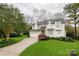Charming home with well-manicured lawn, mature trees and inviting curb appeal at 501 River Oaks Ln, Charlotte, NC 28226