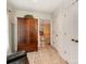 Hallway featuring a wooden cabinet, neutral paint, and doorways to other rooms at 501 River Oaks Ln, Charlotte, NC 28226