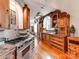 Spacious kitchen featuring custom wood cabinetry, stainless steel appliances, a gas range and hardwood floors at 501 River Oaks Ln, Charlotte, NC 28226