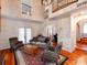 A grand living room with tall ceilings, hardwood floors, and comfortable seating arrangement at 501 River Oaks Ln, Charlotte, NC 28226
