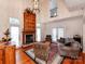 Cozy living room with fireplace, hardwood floors, and access to the backyard at 501 River Oaks Ln, Charlotte, NC 28226