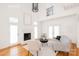 Bright living room boasts a fireplace, high ceilings, and light hardwood floors at 501 River Oaks Ln, Charlotte, NC 28226