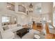 Bright, open living room featuring hardwood floors, modern decor, and a view into the spacious kitchen at 501 River Oaks Ln, Charlotte, NC 28226