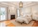 Bedroom rendering boasts a fireplace, hardwood floors, and a decorative ceiling light at 501 River Oaks Ln, Charlotte, NC 28226