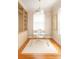Bright, modern home office with glass desk and built-in shelving at 501 River Oaks Ln, Charlotte, NC 28226