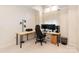 Bright office features neutral carpet, a spacious desk, and well-lit workspace perfect for productivity at 501 River Oaks Ln, Charlotte, NC 28226