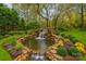 Rendering of a beautiful backyard pond with a waterfall feature, and lush landscaping at 501 River Oaks Ln, Charlotte, NC 28226