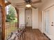 Inviting porch with wood floors, a ceiling fan, and relaxing outdoor seating with peaceful scenery at 501 River Oaks Ln, Charlotte, NC 28226