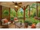 Rendering of a serene porch with comfortable seating, a coffee table and views of wooded scenery at 501 River Oaks Ln, Charlotte, NC 28226