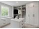Spacious walk-in closet with custom shelving, drawers, and ample storage space at 501 River Oaks Ln, Charlotte, NC 28226