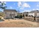 Wide angle shot of a home's backyard with patio and privacy fence, on a sunny day at 5011 Tatton Ln, Indian Land, SC 29707